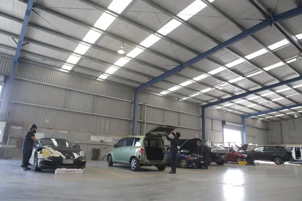 Car painting spray booth at Auckland Panel and Paint — environmentally friendly water-based paint, factory finish